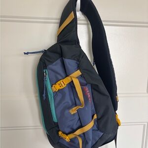 Patagonia Atom 8L Sling Bag Crossbody Backpack in Blue, Yellow, and Gray